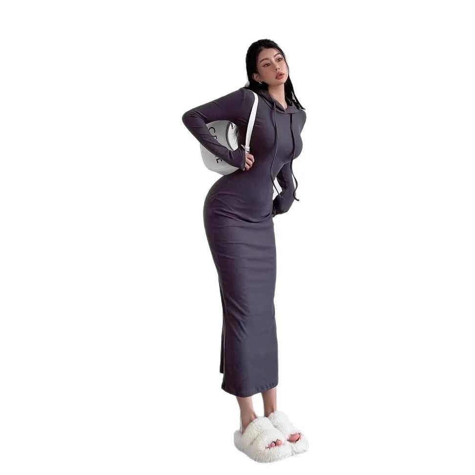 Women's grey hooded sheath dress with over-the-knee length and long sleeves showing high waist design