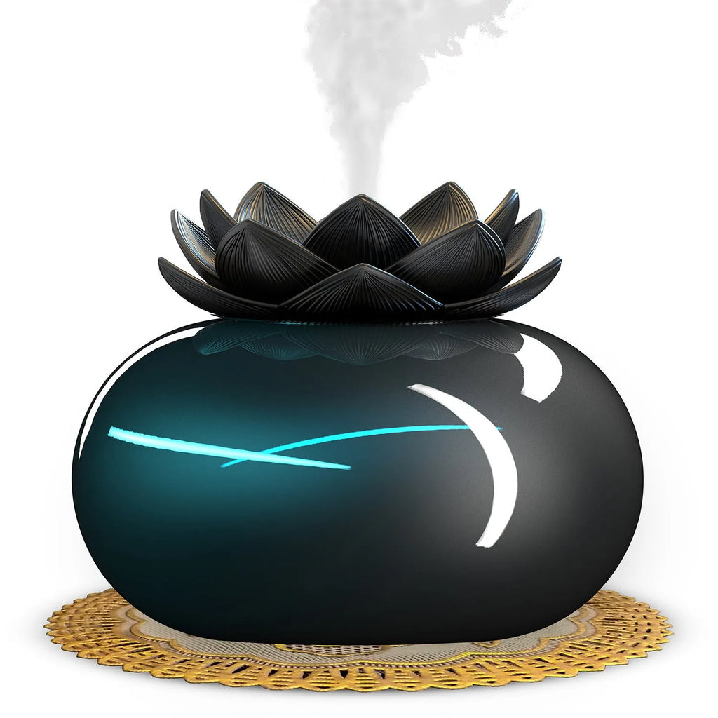 Black round Lotus aromatherapy humidifier with USB cable connection showing mist output