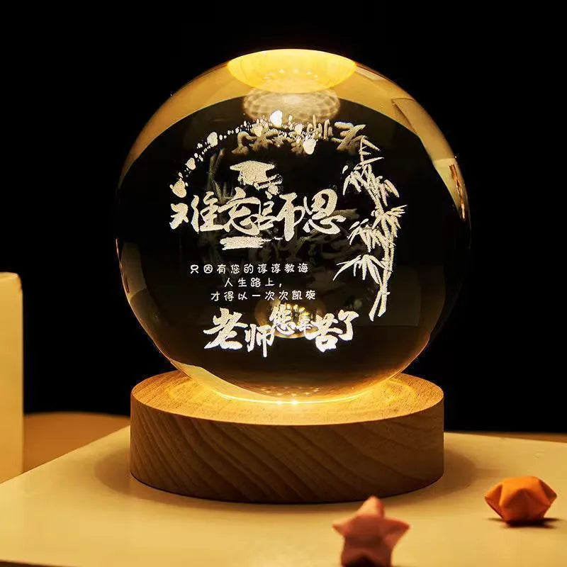3D crystal ball night light projecting starry sky and planets from its 6cm sphere on a solid wood base.