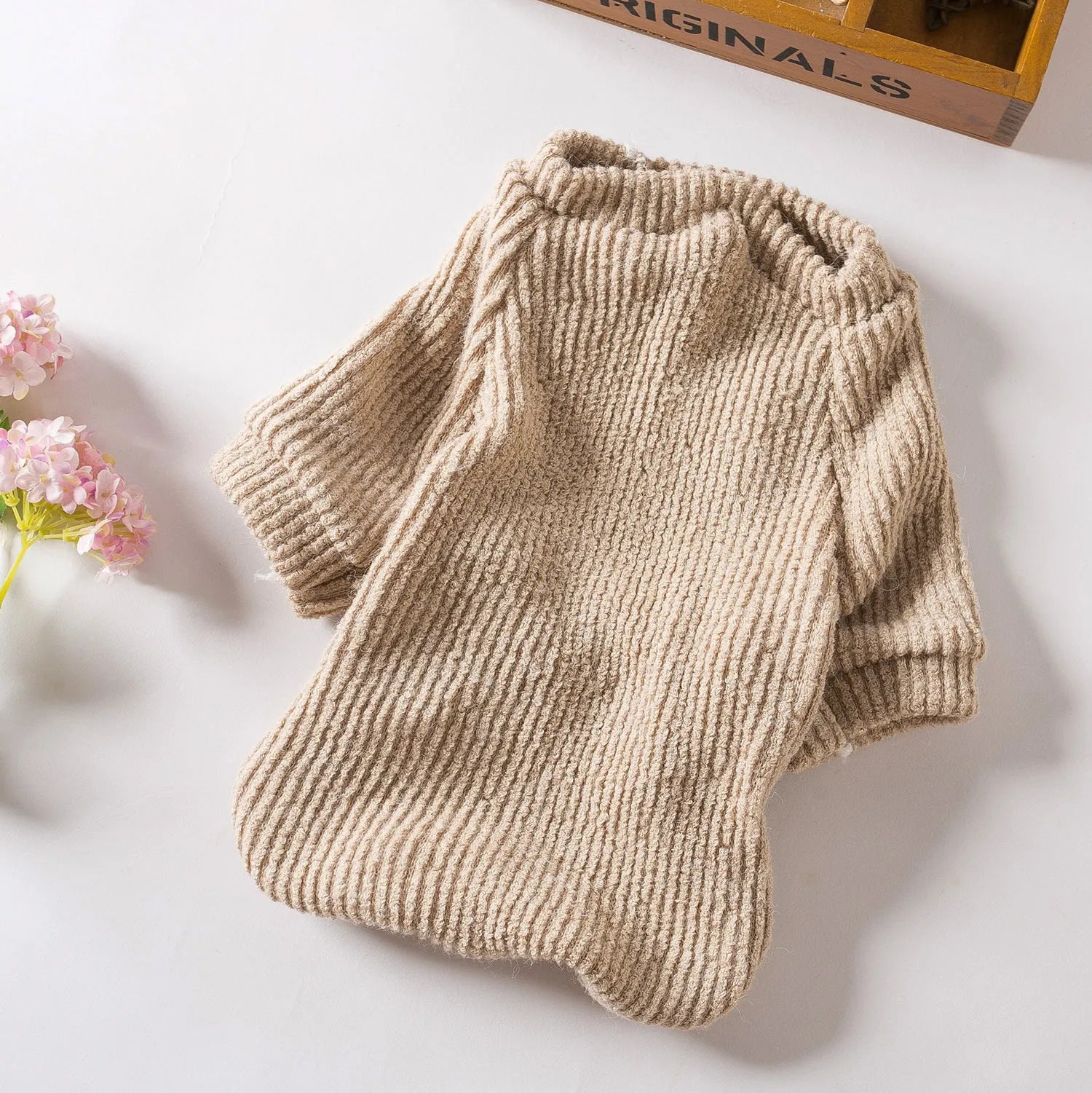 Brown cloth sweater for small dog on white background showing pullover design and casual style