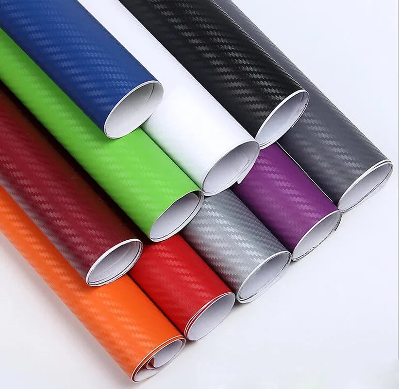 Roll of black carbon fibre textured vinyl sticker for car decoration, showing 3D pattern.