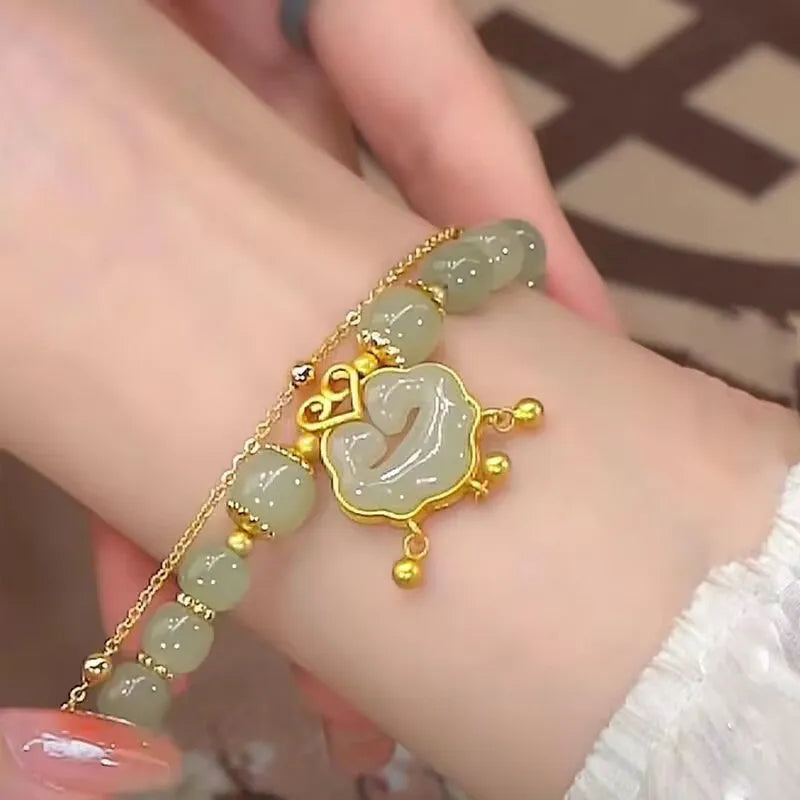 Green women's safety lock bell pendant bracelet with electroplated finish and drop-shaped charm