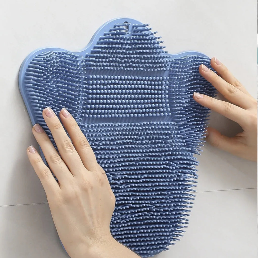 Blue silicone bath massage cushion measuring 31x32cm on white background
