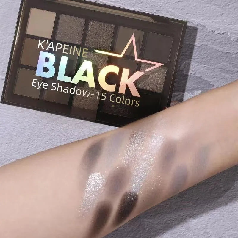15-colour eyeshadow palette open showing matte and shimmer shades including browns and blues