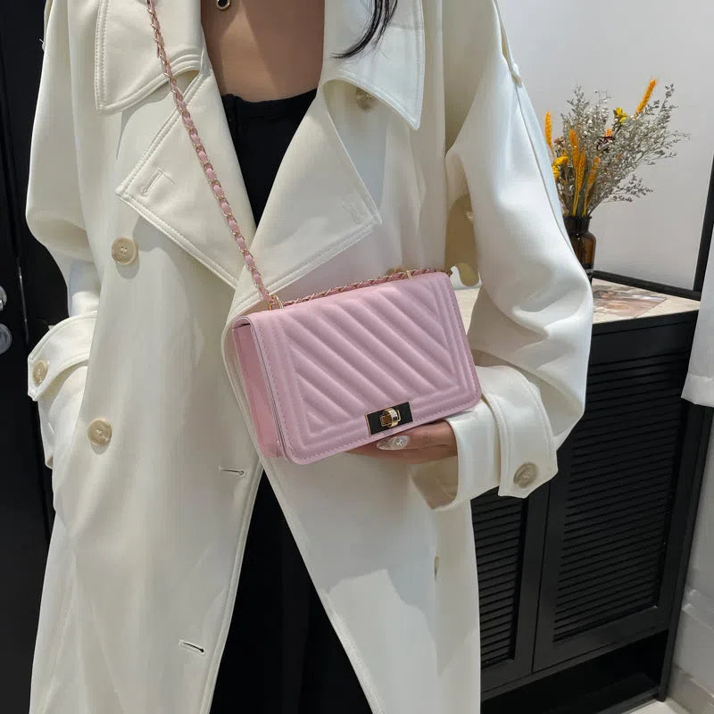 Single shoulder crossbody bag in PU with stitching detail, horizontal rectangle shape, shown in one of 14 colours