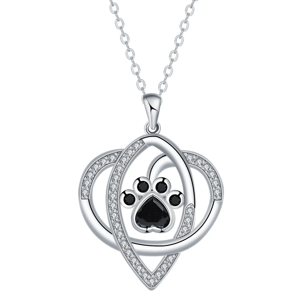 Copper pendant necklace showing cat and dog paw prints on a delicate cross chain.