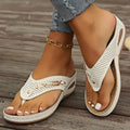 Women's retro-style flip-flop sandals in light brown with a herringbone pattern footbed.