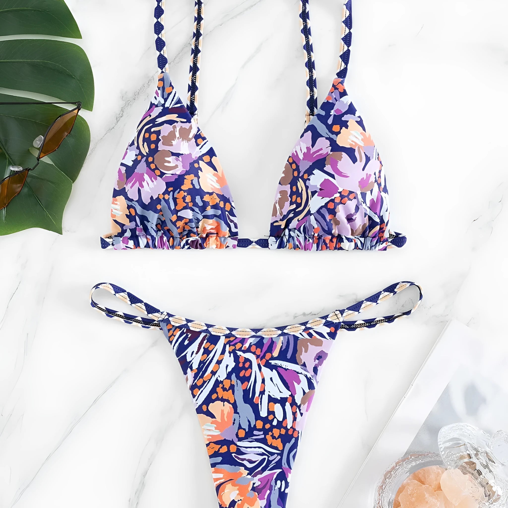 Women's floral print triangle bikini with tie-back and split-front polyester briefs.