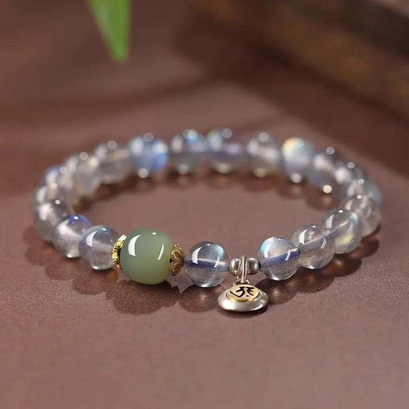 Women's bracelet with 8mm moonstone bead and electroplated Thousand-Hand Kwan-yin mouse charm.