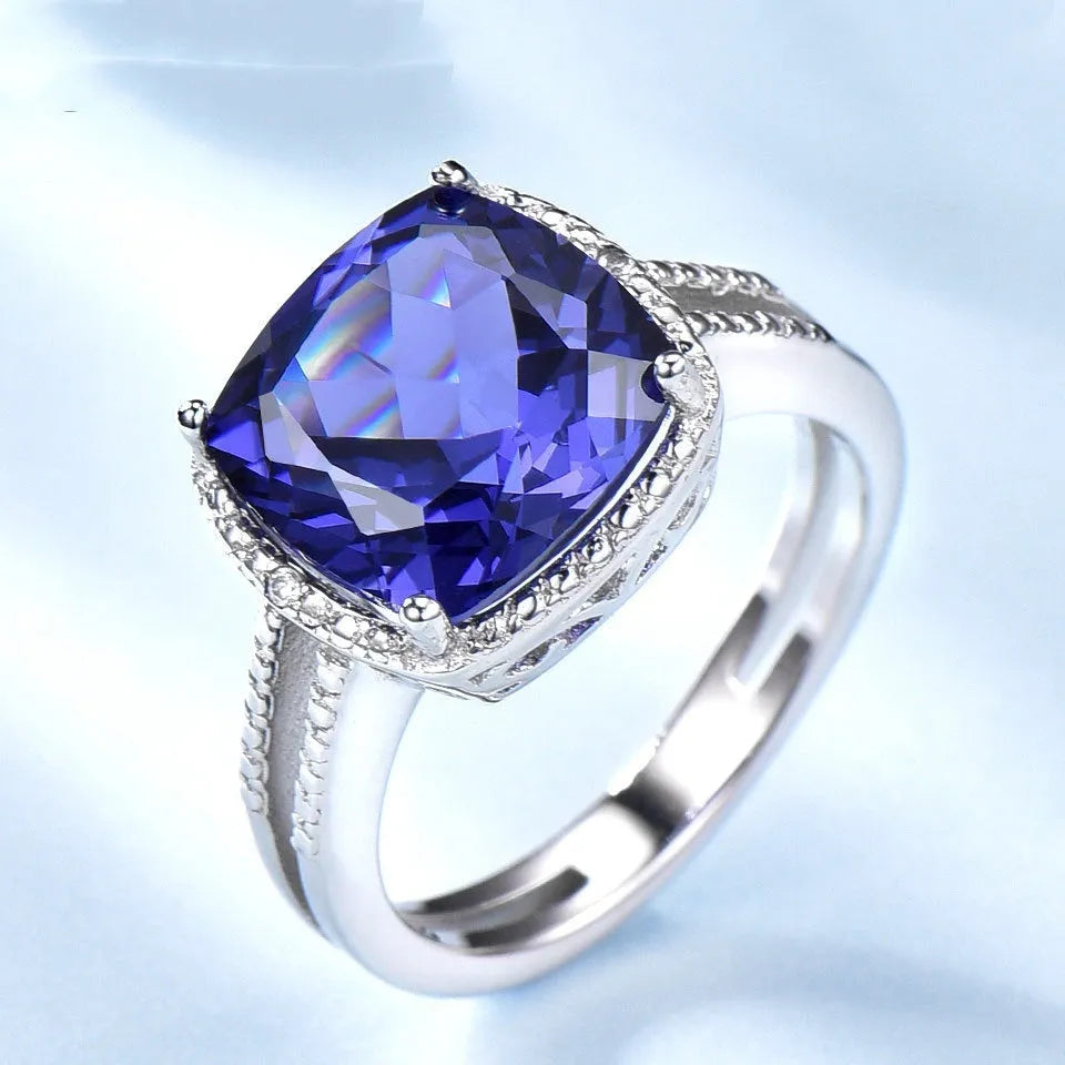 Women's 925 sterling silver ring with blue tanzanite gemstone, shown in UK sizes 6-10 for precise fit