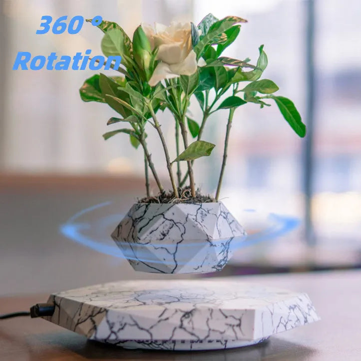 Marble-coloured levitating plant pot floating and rotating with magnetic technology for bonsai or small plants