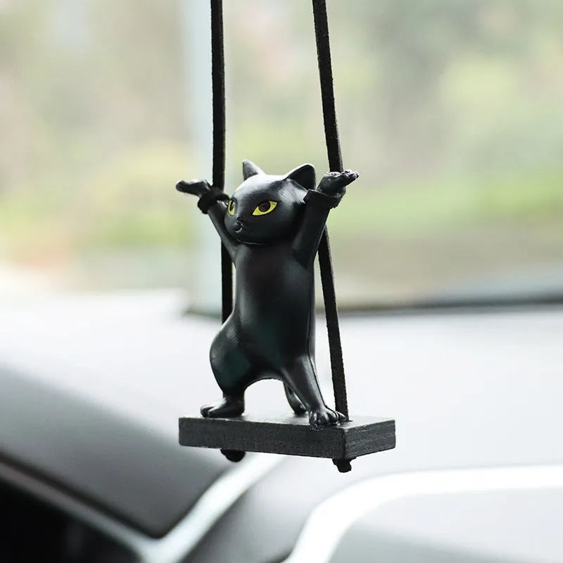 Cartoon-style resin cat pendant for car interior decoration in various colours with adjustable rope.