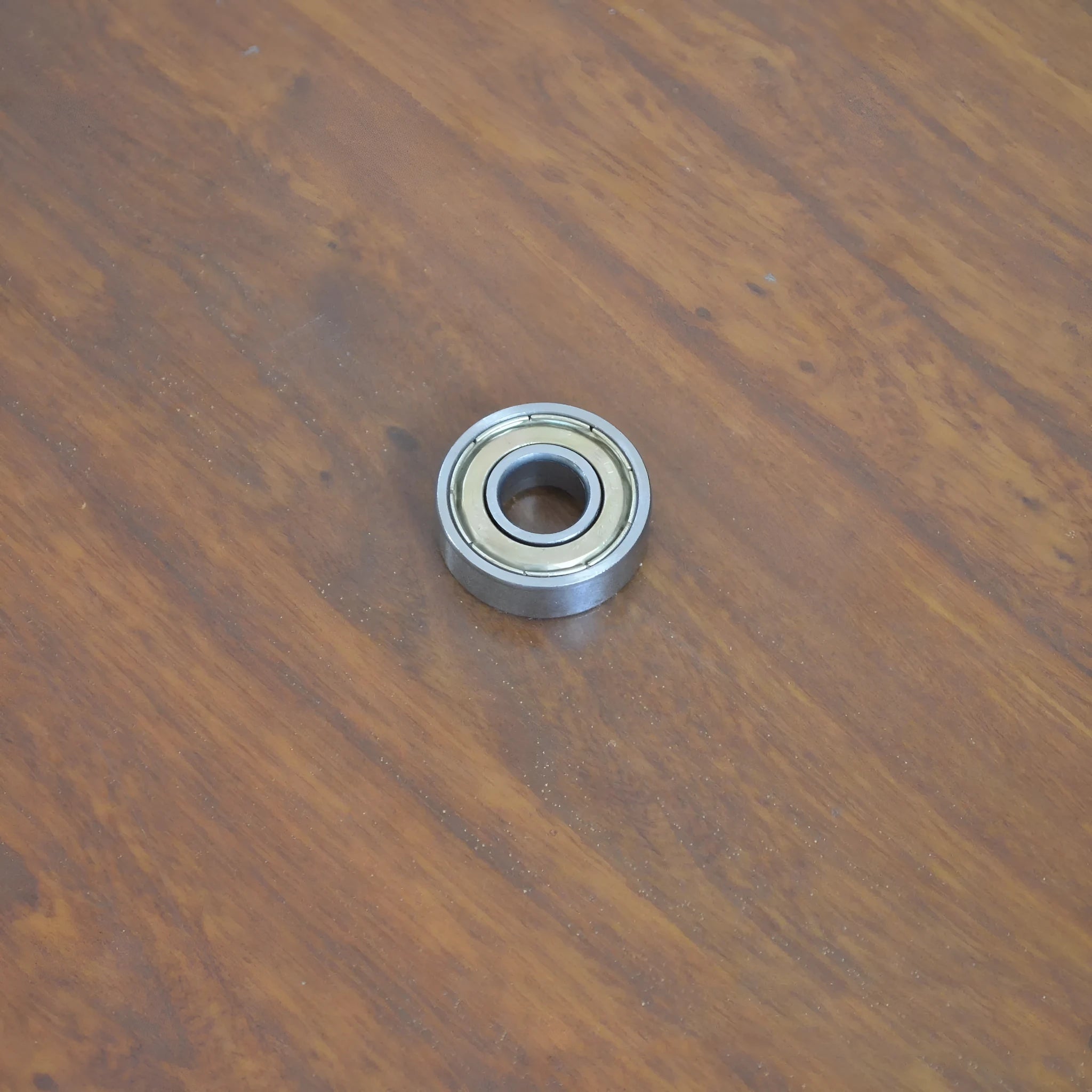 6000zz carbon steel radial ball bearing with 10mm bore, 26mm outer diameter, and steel retainer.