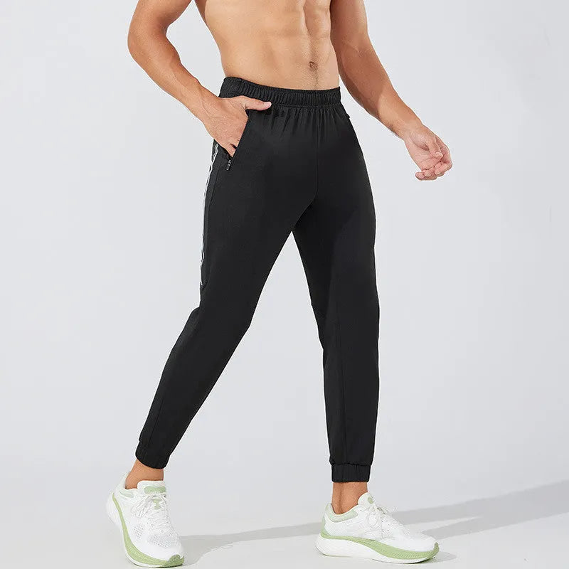 Men's black running trousers with mid-waist design and polyester construction for breathable sports performance