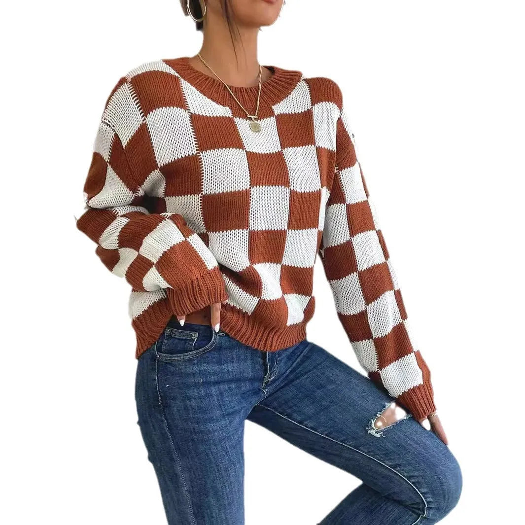 Dark brown plaid pattern pullover sweater with long sleeves and round neck, laid flat showing full design