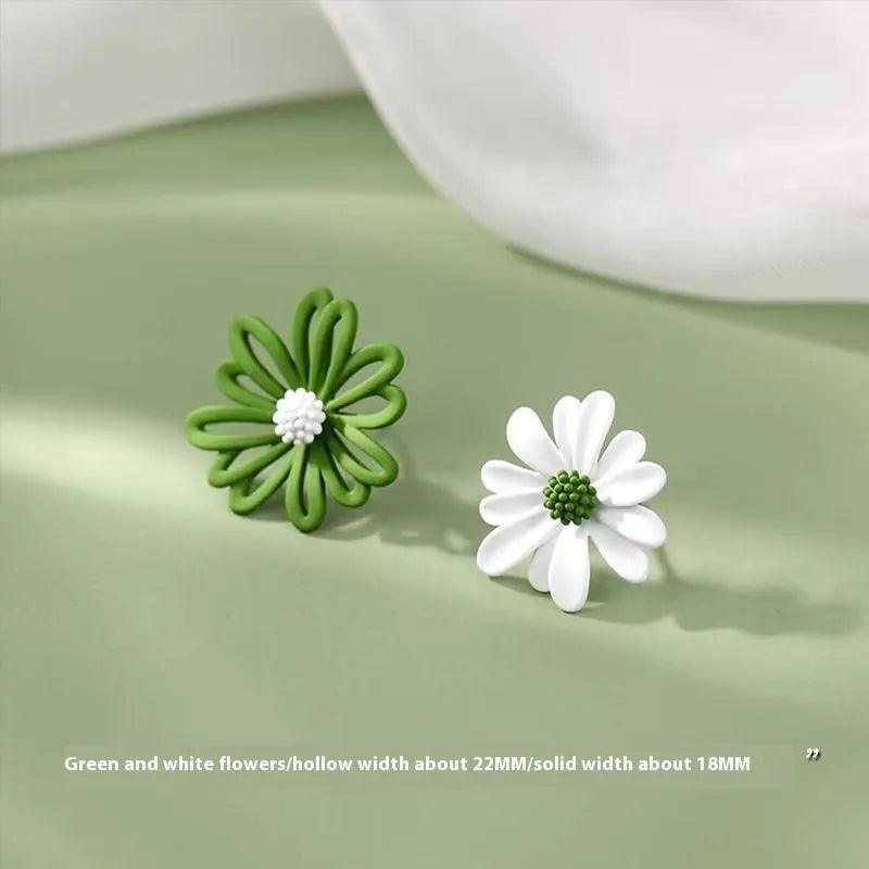 A pair of alloy flower stud earrings in a blue and orange two-tone colour contrast on a white background.