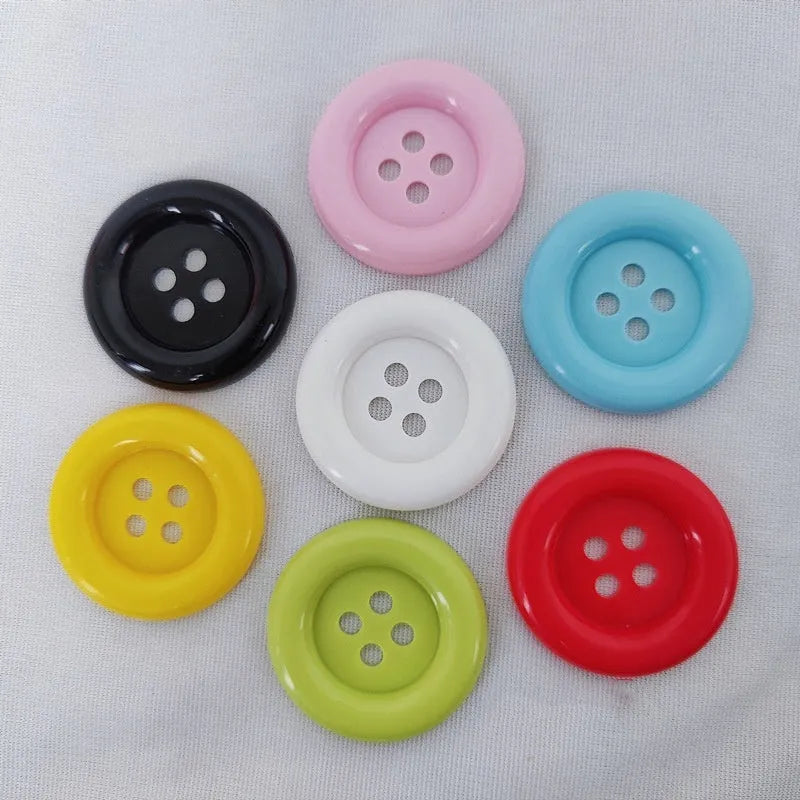 Oversized round plastic nylon buttons with 4 holes in various colours and sizes from 38mm to 70mm diameter