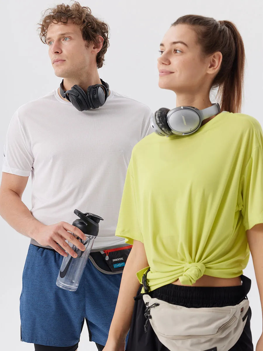 Men's straight-cut nylon sports shorts with side slits, shown in turmeric yellow, for summer athletic wear.
