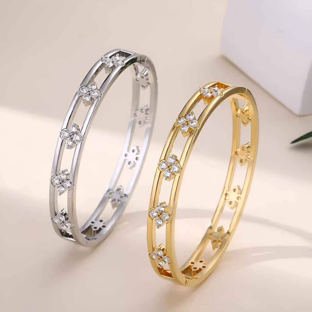 Gold and silver hollow women's bracelets with four-leaf clover charms and inlaid zircon detailing.