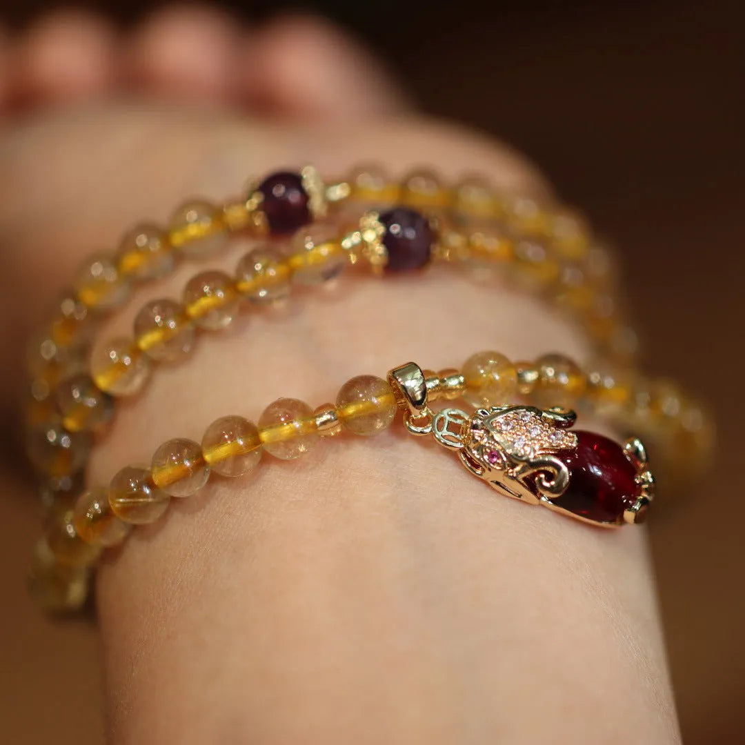 Natural Brazil gold rutilated quartz bracelet with three gold circles and ruby accents in Chinese-style design