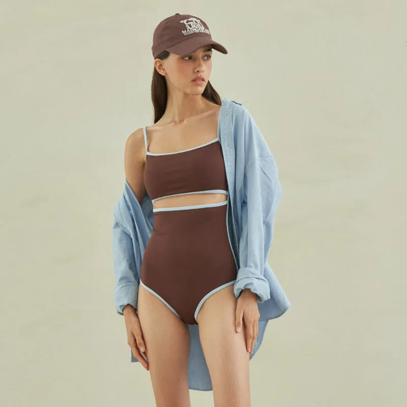 Brown triangle one-piece swimsuit for women with nylon fabric and sizes M, L, XL.