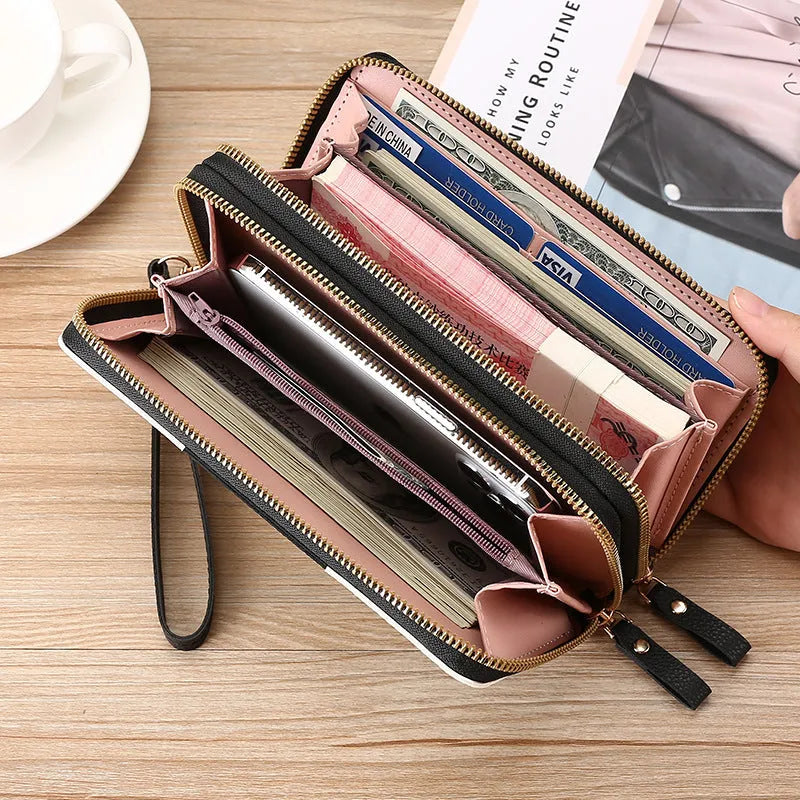 Retro style long wallet clutch in PU leather with a print design, shown in black colour.