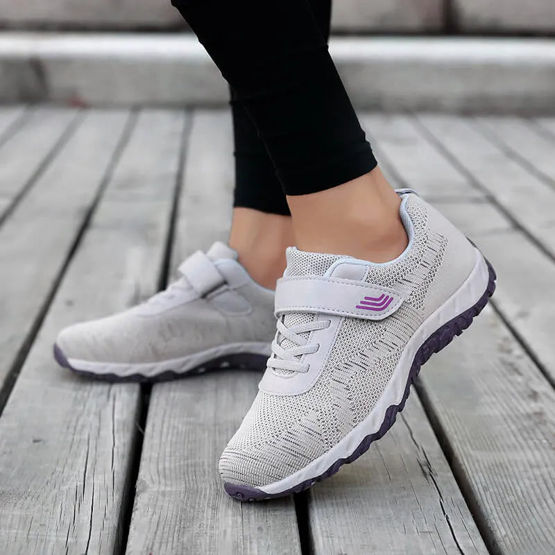 Women's low-top wedge shoes with Velcro strap and mesh upper in a solid colour