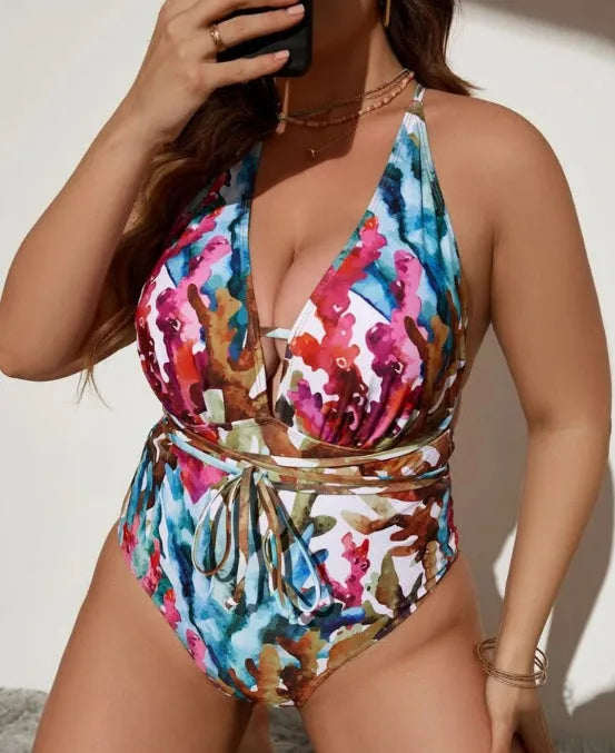 Blue one-piece halter swimsuit with brief cut on mannequin showing European American styling