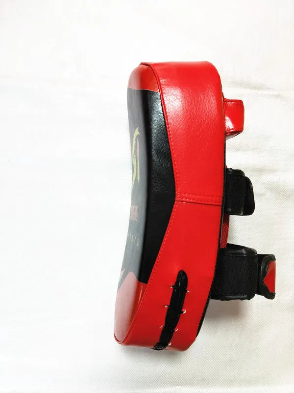 Black and red hand-held martial arts target pad showing double buckle strap on back
