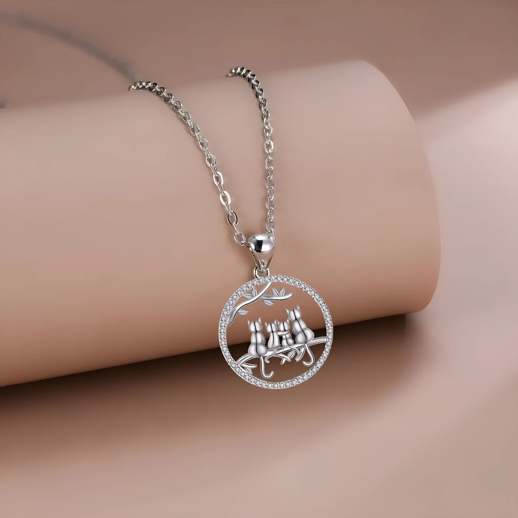Original design copper cat pendant necklace with a cross chain, featuring a four kitten pattern.
