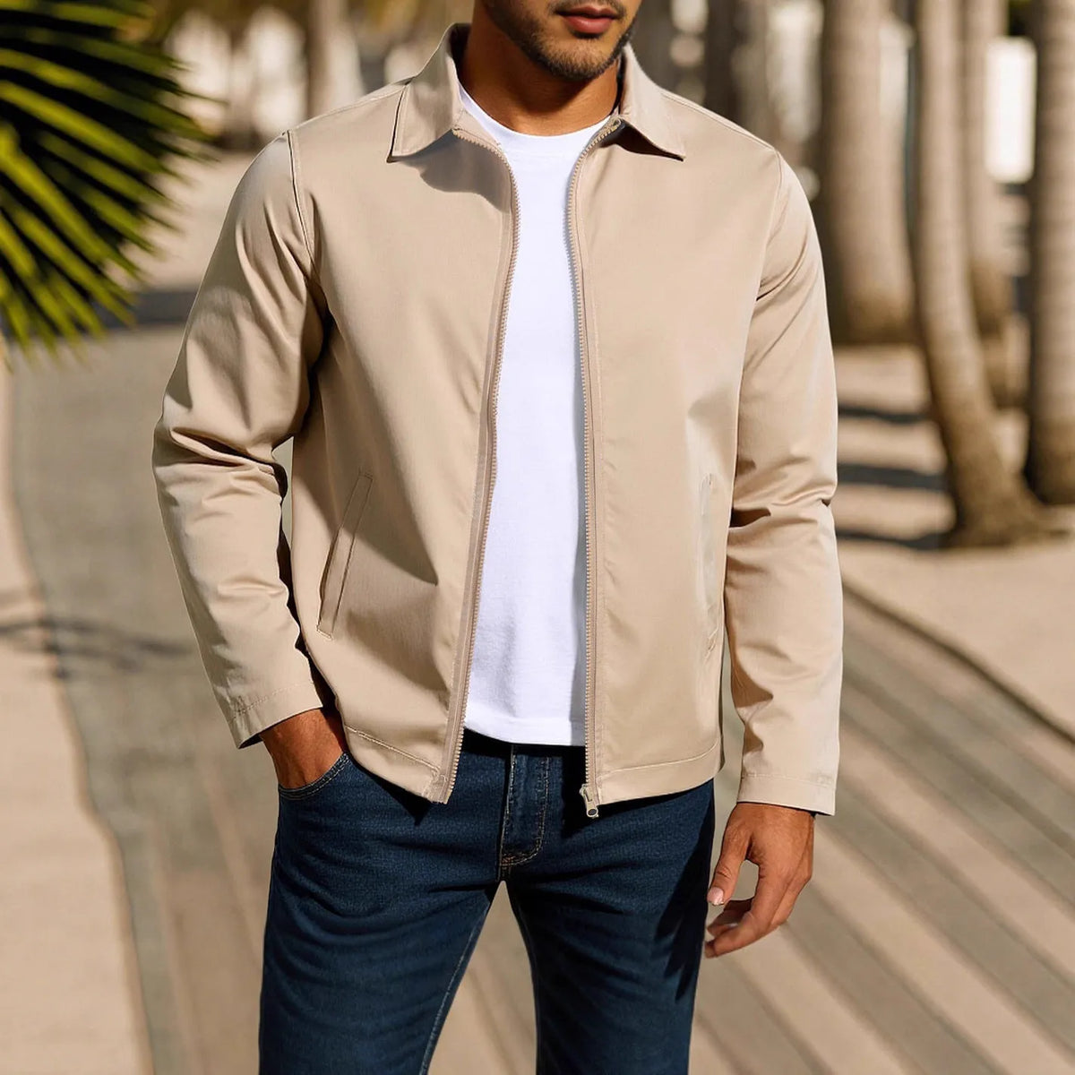 Man wearing an emerald green zippered cardigan jacket with raglan sleeves.
