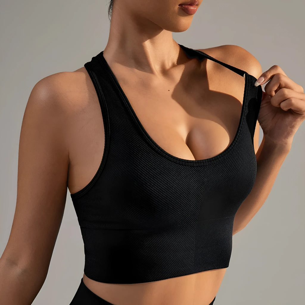Black women's cross back sports bra with fixed double straps and molded cups.