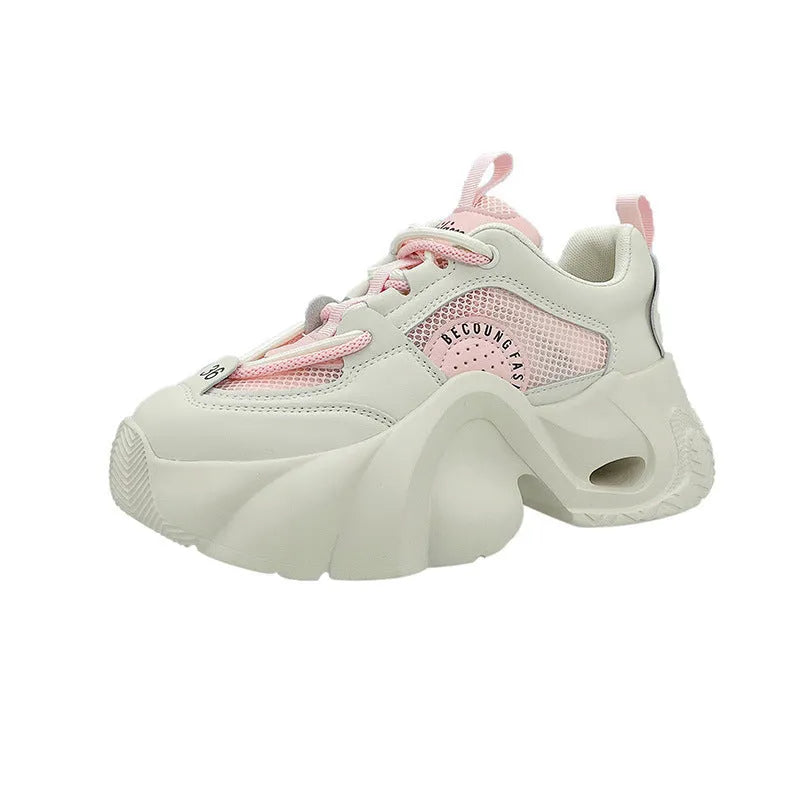 Women's pink sneakers with cross straps, 3-5cm thick sole, and mesh lining for breathable comfort