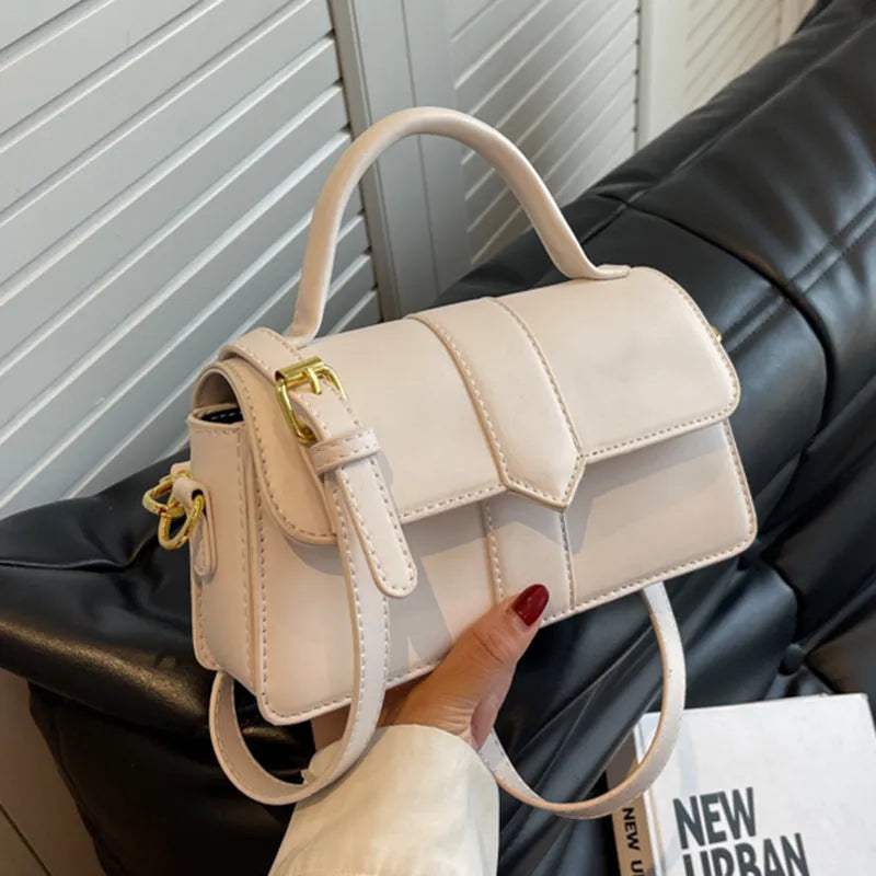 Women's beige messenger bag with 22cm width showing file compartment and exterior pocket