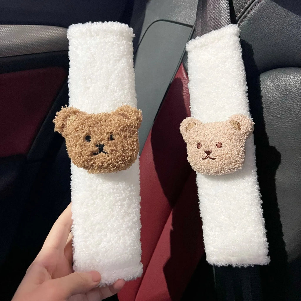 Cartoon bear design plush car seat belt protective cover for infant safety, showing khaki and coffee colour options