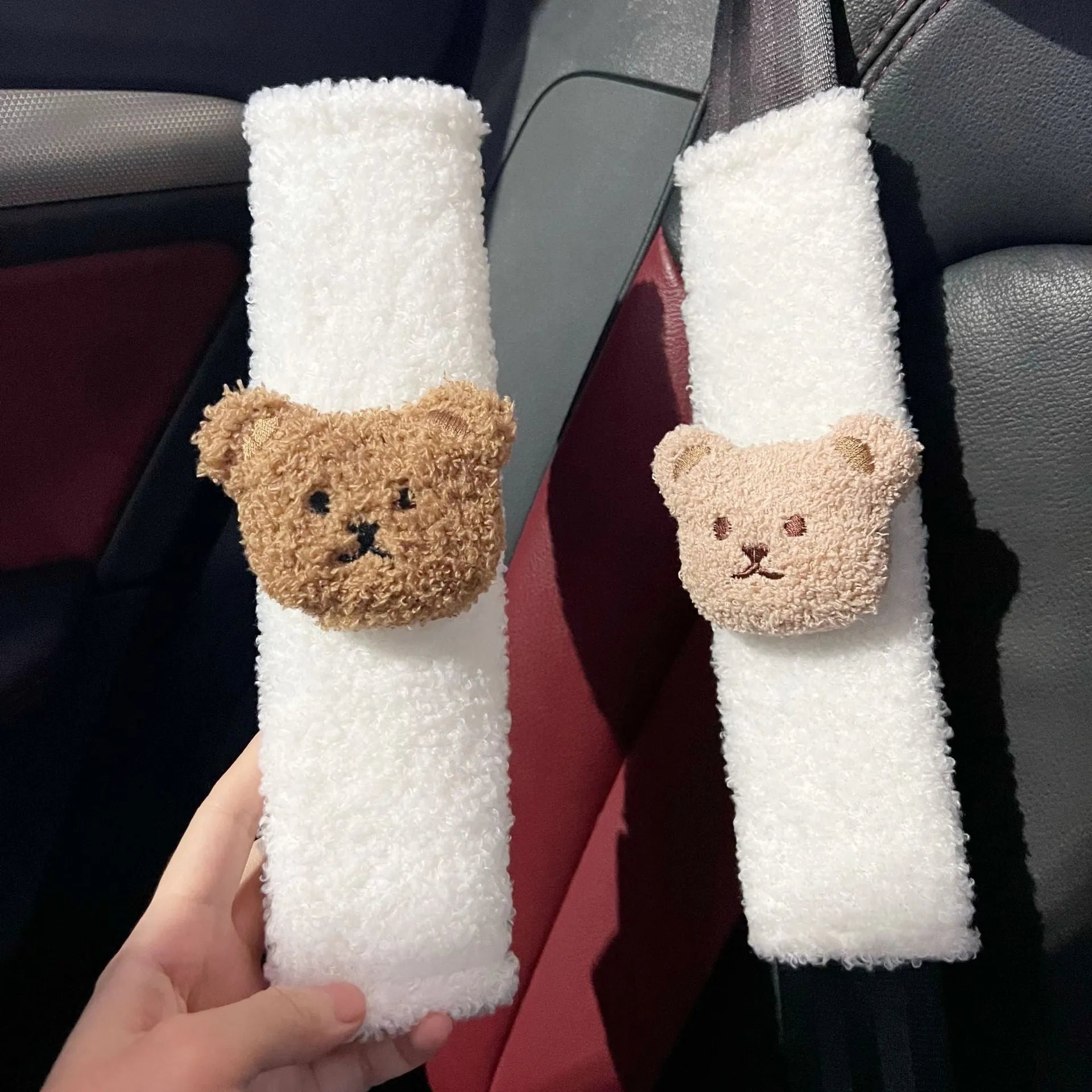 Cartoon bear design plush car seat belt protective cover for infant safety, showing khaki and coffee colour options