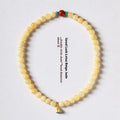 Hand-woven yellow topaz double ring bracelet with lotus seedpod beads for women.