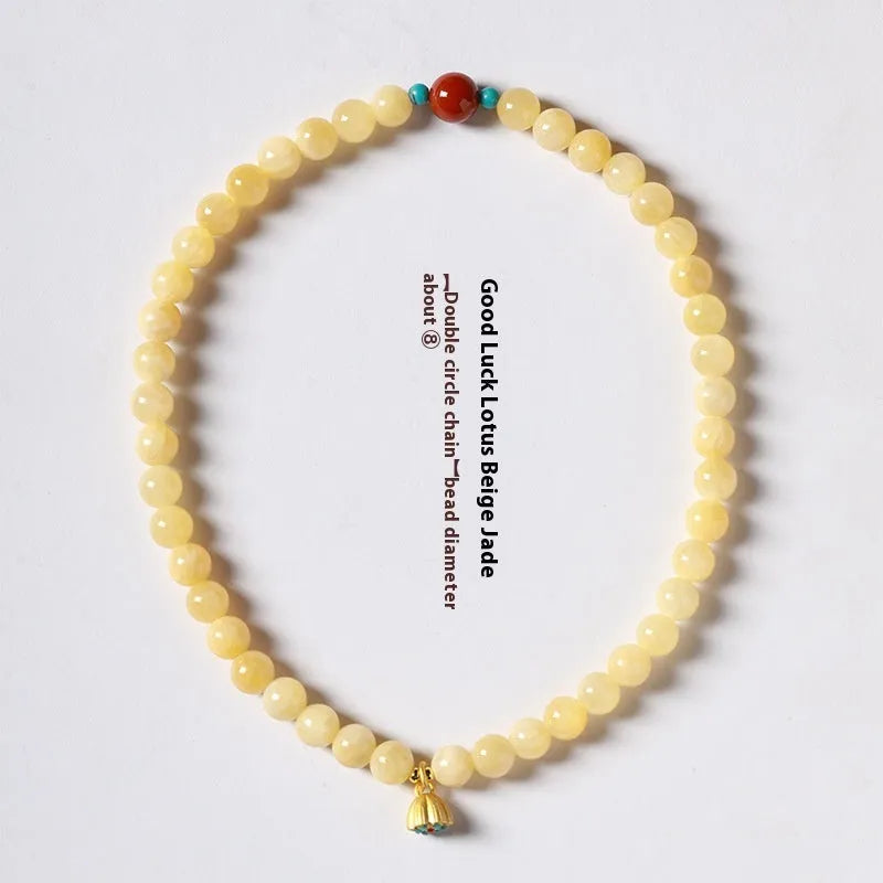 Hand-woven yellow topaz double ring bracelet with lotus seedpod beads for women.