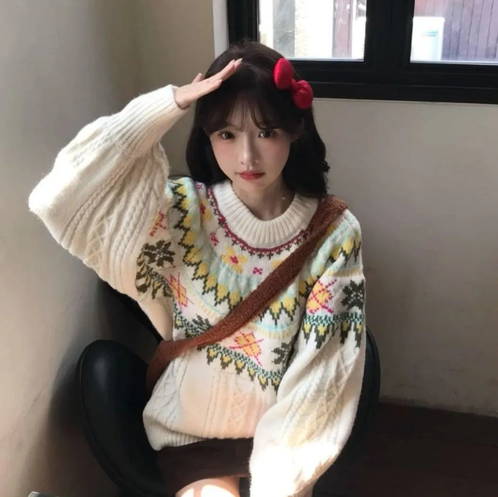 Women's milky white knitwear pullover with lantern sleeves and a loose fit.