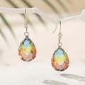 Pair of women's heart-shaped drop earrings in coloured glaze, showing one of four colour options.