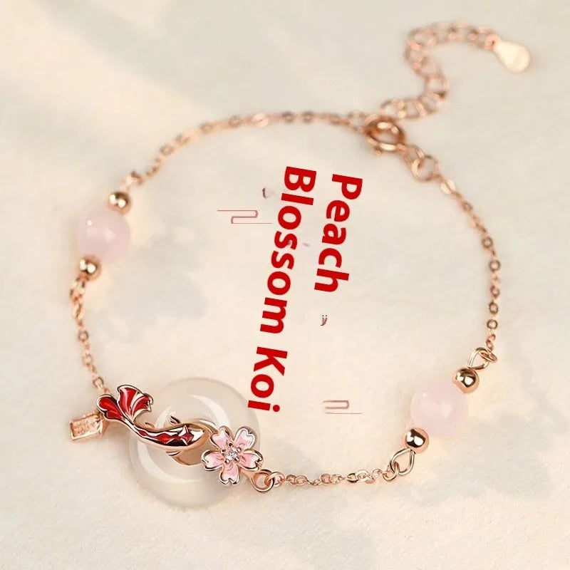 S925 sterling silver bracelet with white chalcedony crystal flower and engraved koi fish design.