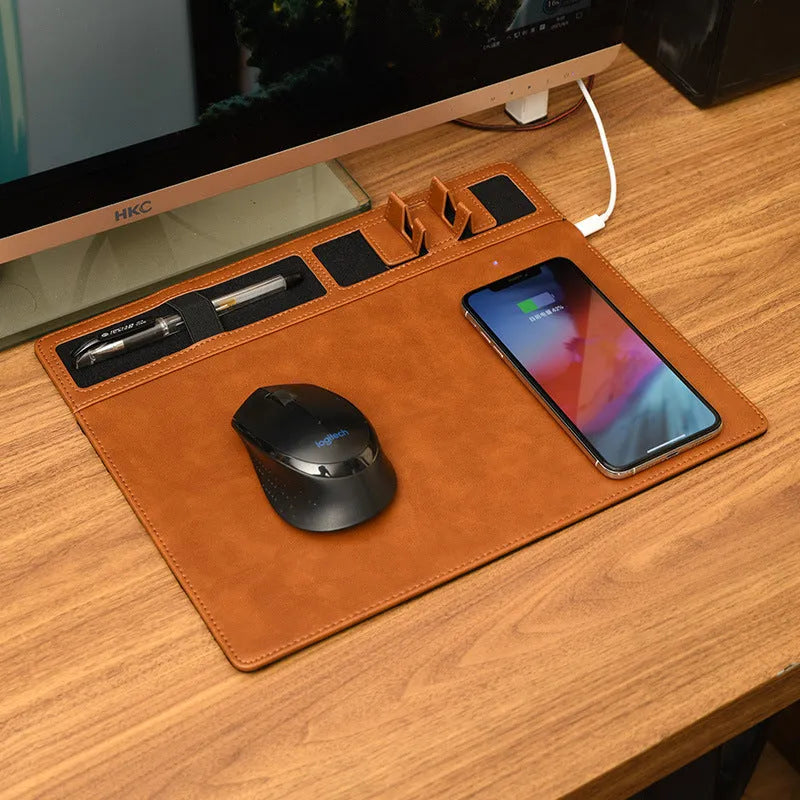 Multifunctional wireless charging mouse pad with phone holder on desk, showing 320x260mm PU surface in black colour