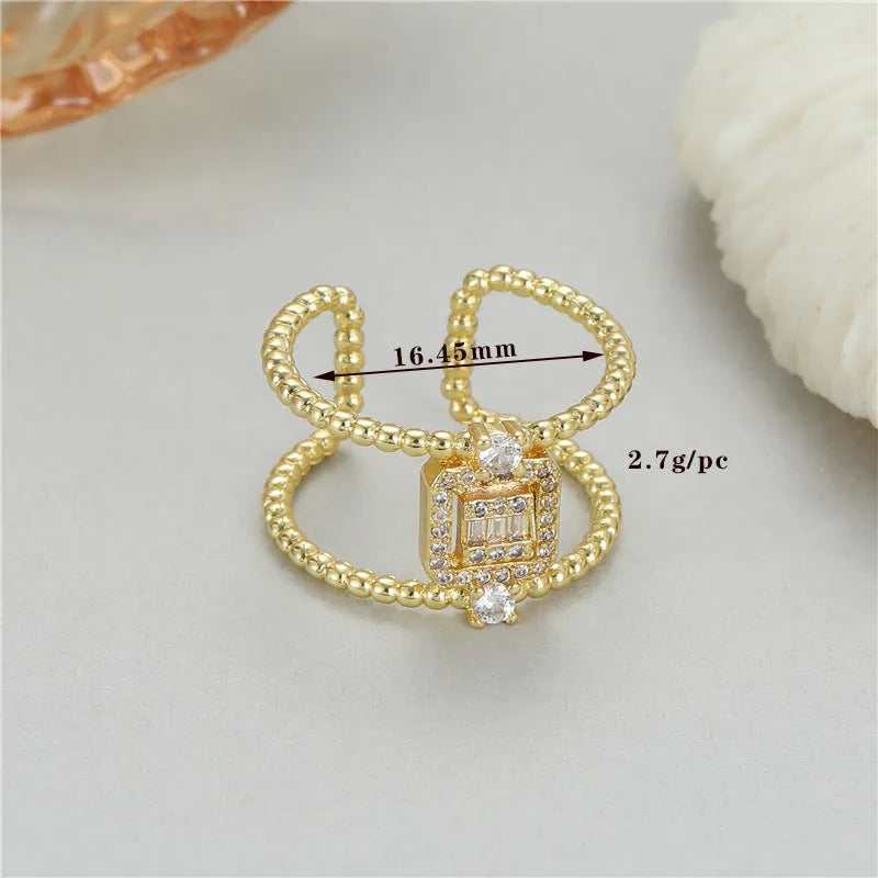 Adjustable opening copper ring with 14K gold plating and asymmetric U-shaped design
