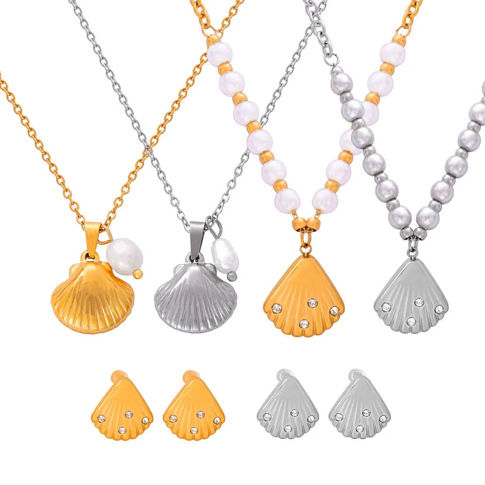 French vintage shell pendant necklace with titanium steel chain and freshwater pearl bead on gold background