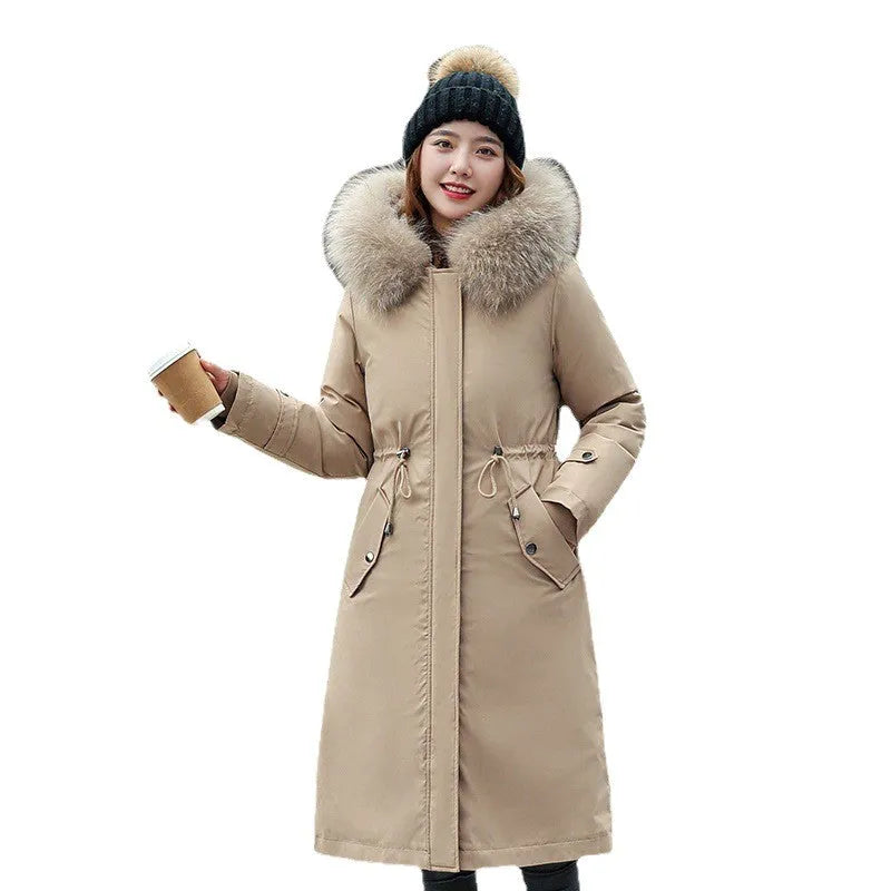 Women's long beige trench coat with down cotton filler, 100cm length, and two-way design shown in outdoor setting