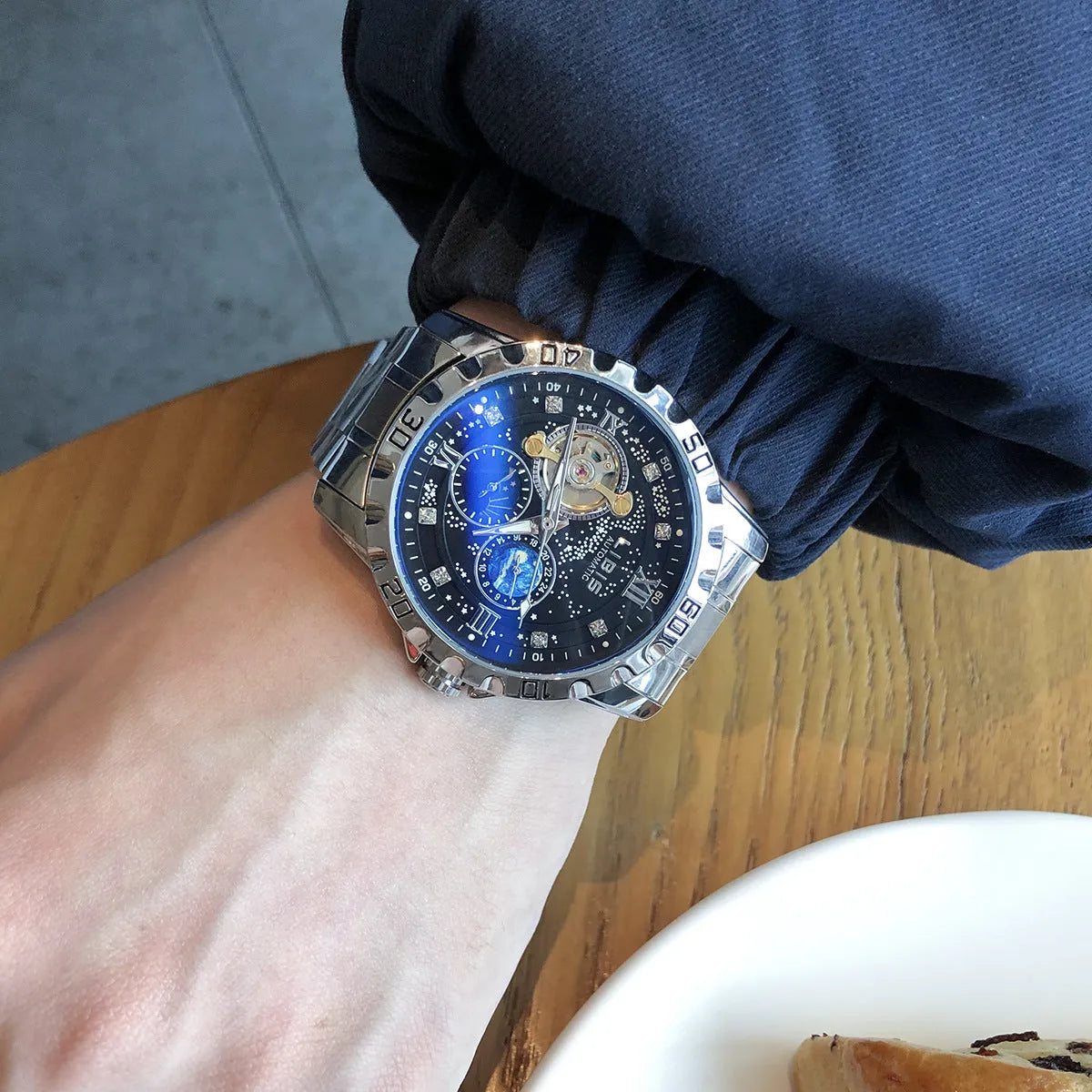 Men's silver case black dial automatic watch with luminous markers and genuine leather strap