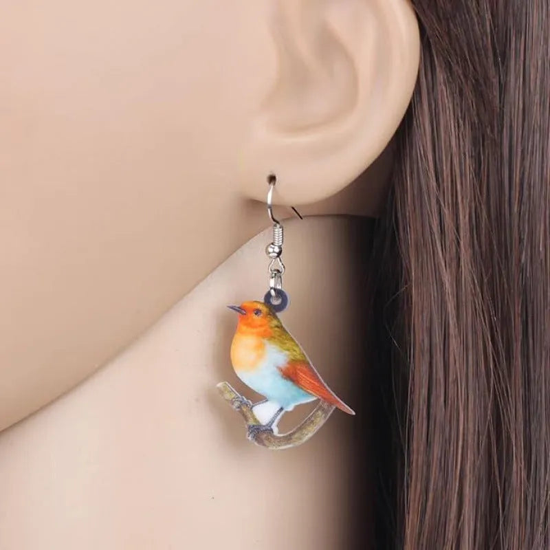 Acrylic geometric earrings with blue titmouse pendant design and snake element accents