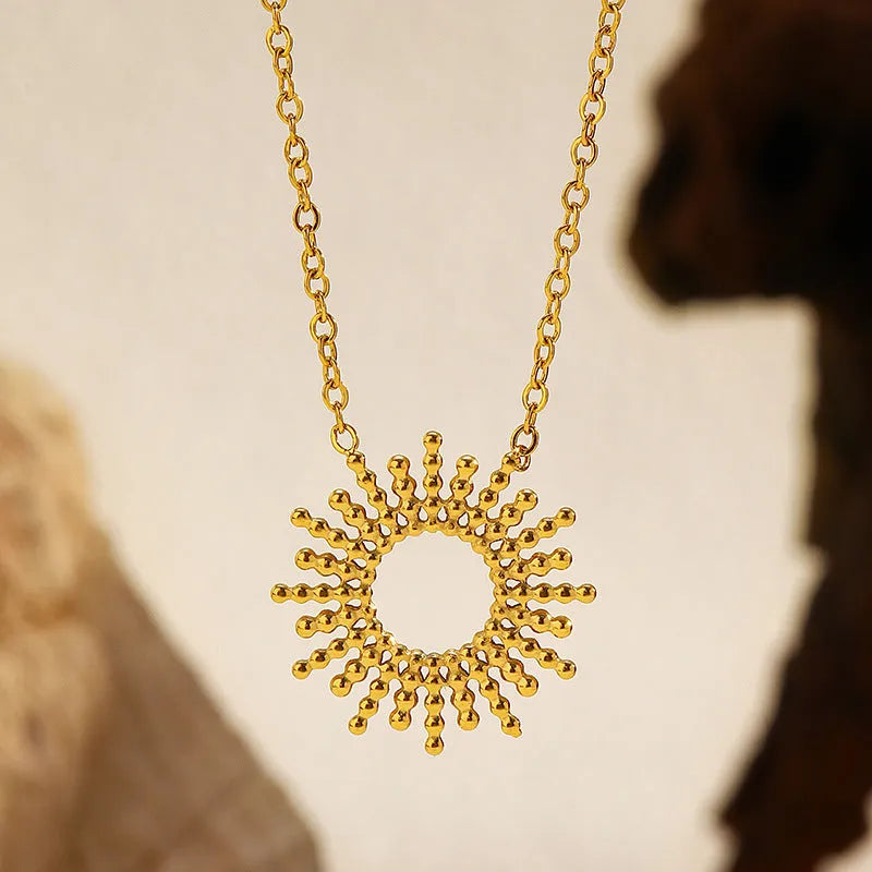 SUNFLOWER Series gold bracelet and necklace set with geometric chain design on a white background
