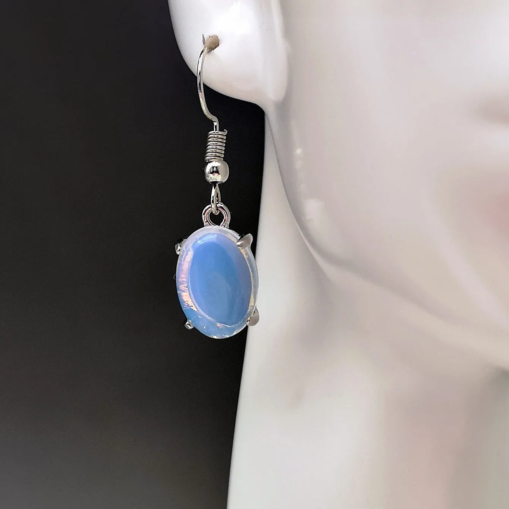 Electroplated alloy opal earrings with moonlight white finish and retro moonstone drop design featuring cross motif