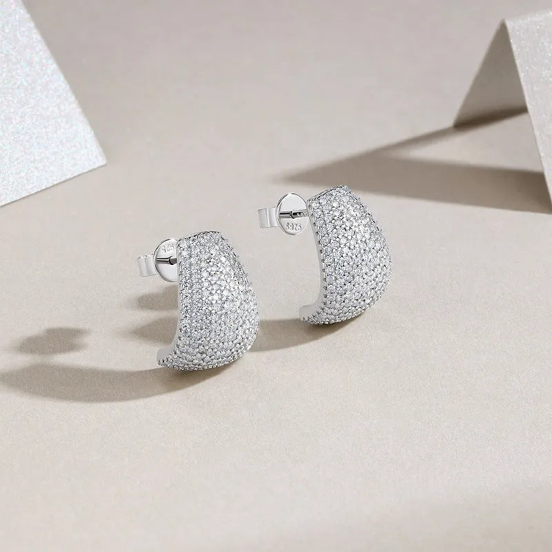 Geometric silver stud earrings with moissanite stones showing front and back views